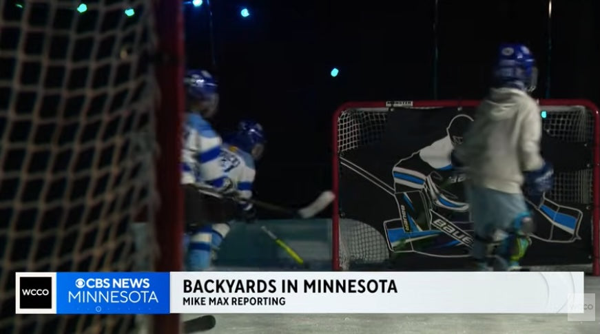 Snippet from CBS News Minnesota segment on backyard ice rinks, with four young hockey players playing on a rink with nets. 